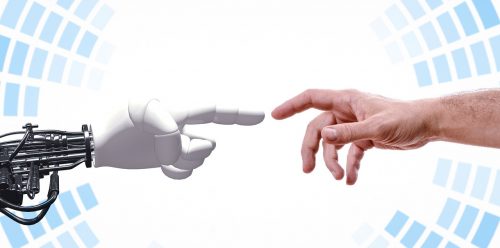 A robotic hand and a human hand touch each other.