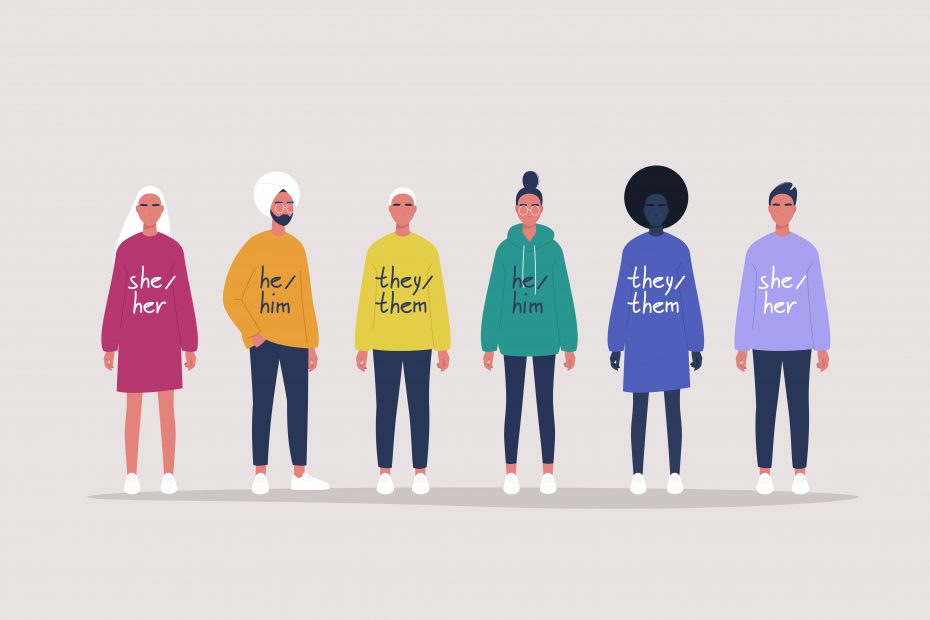 Various people with their respective pronouns written on their clothes to represent gender-inclusive language.